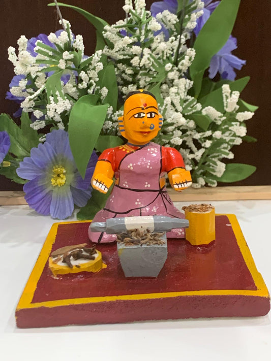 Sitting worker - grinding masala