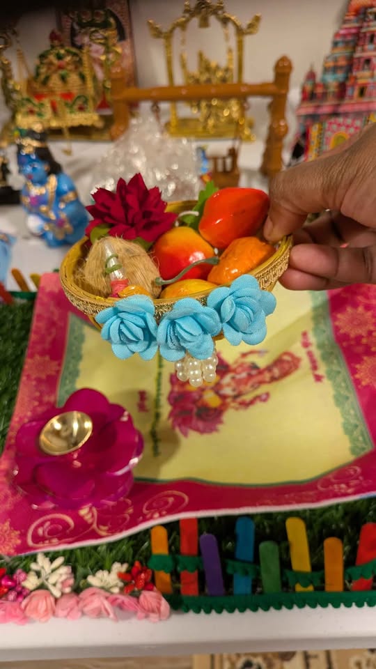 Rose diya with mini fruit basket
